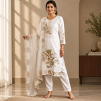 Women's white ethnic co-ord set in an elegant realistic interior with natural light